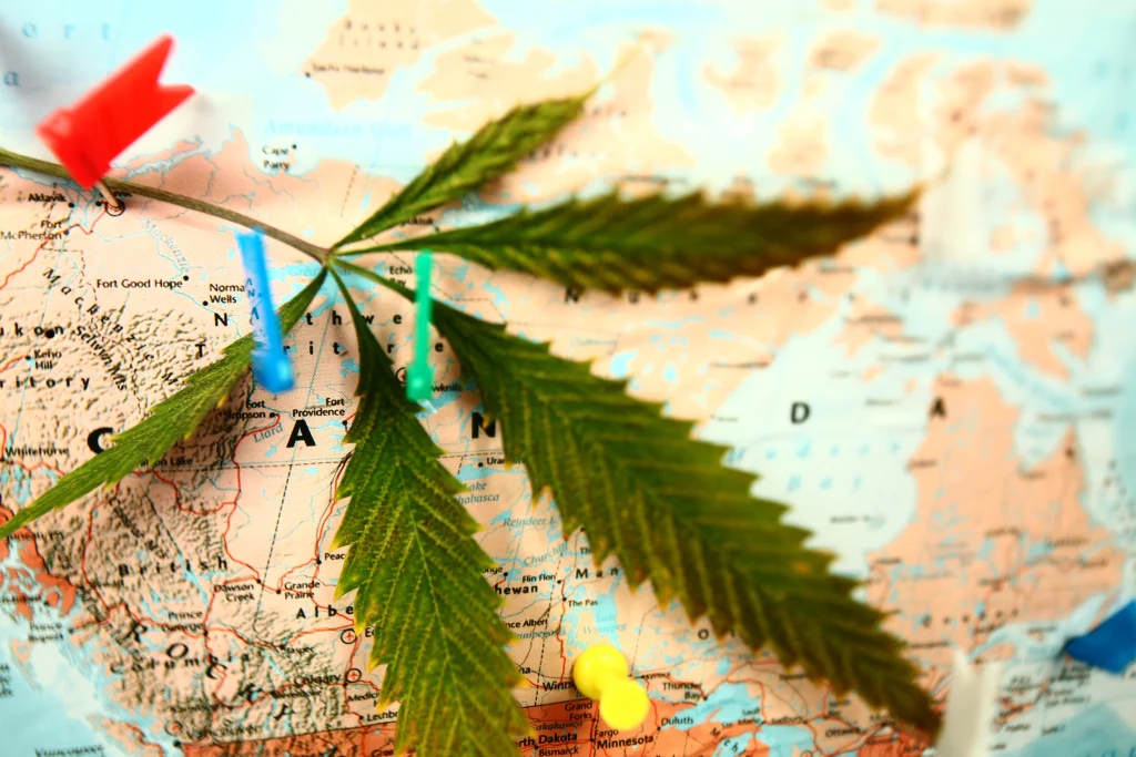 Cannabis travel; marijuana leaf on the map of Canada