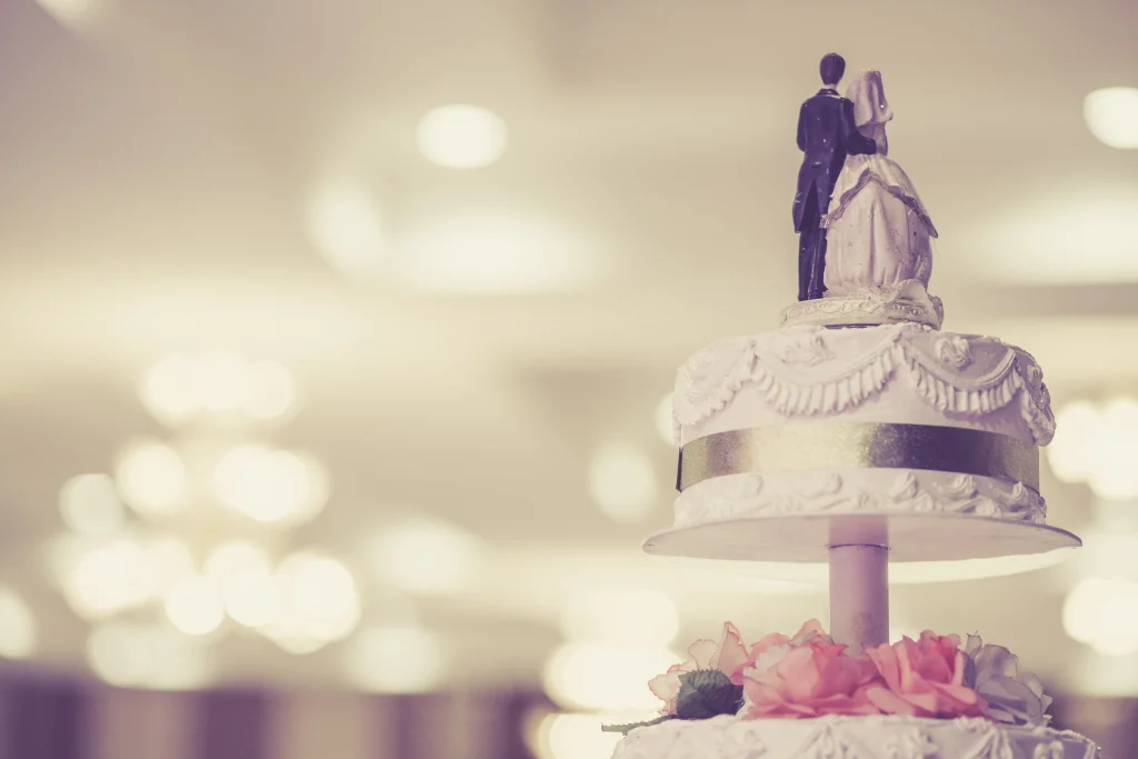 Vintage wedding cake with man and woman cake topper; Wedding Crasher strain