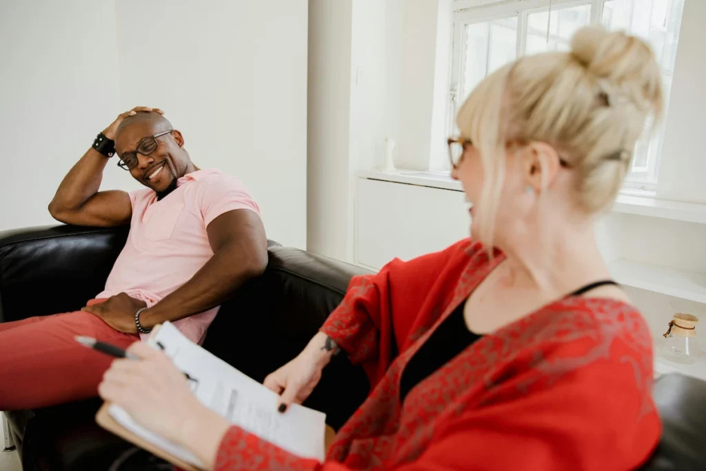 Smiling patient speaking with a behavioral health provider