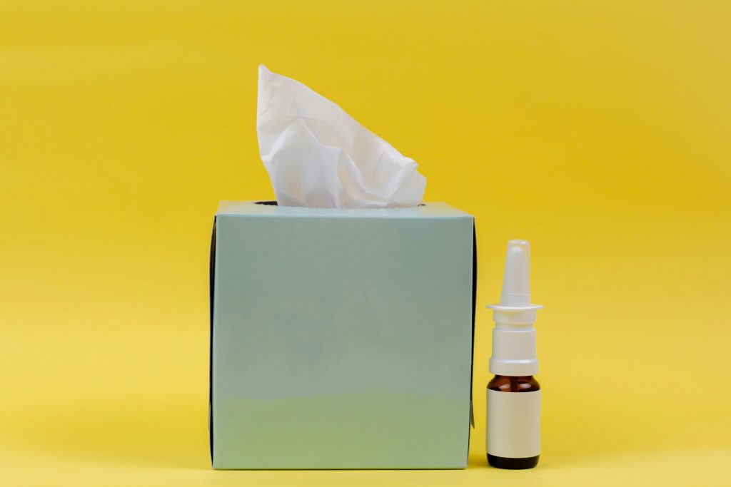 Nasal spray next to tissues